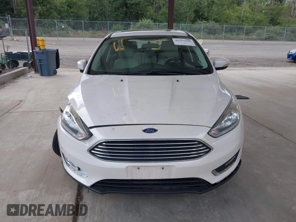 2018 Ford Focus Titanium z VIN 1FADP3N27JL314856, wystawiony jako IAAI lot #42553390 z przebiegiem 82 936 mil mil oraz . Historia ofert i sprzedaży dostępna na DreamBid. Obrazek 12.