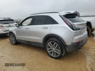 2022 Cadillac XT4 FWD Sport with VIN 1GYFZER47NF111047, listed as a Copart auction lot 50958135 with 14,448 mi miles and Salvage Title. Bid and sale history available at carsss.com. Image 2.