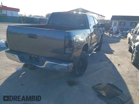 2012 Toyota Tundra 4WD Truck with VIN 5TFDW5F10CX259337, listed as a IAAI auction lot 41854421 with 168,577 mi miles. Bid and sale history available at carsss.com. Image 4.