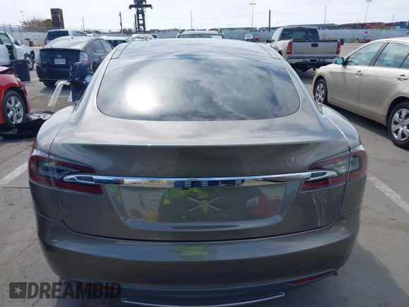 2015 Tesla Model S 85 with VIN 5YJSA1E14FF120455, listed as a IAAI auction lot 42053306 with 62,817 mi miles and . Bid and sale history available at DreamBid. Image 16.