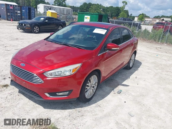 2018 Ford Focus Titanium z VIN 1FADP3J23JL295888, wystawiony jako IAAI lot #42524088 z przebiegiem 108 812 mil mil oraz . Historia ofert i sprzedaży dostępna na DreamBid. Obrazek 19.
