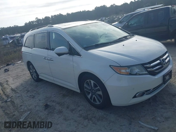 2014 Honda Odyssey Touring with VIN 5FNRL5H97EB127836, listed as a IAAI auction lot 41497413 with 174,914 mi miles and . Bid and sale history available at DreamBid. Image 1.