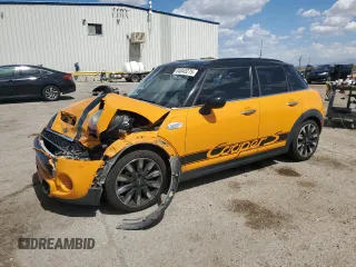 2015 MINI Hardtop 4 Door S with VIN WMWXU3C59F2B58555, listed as a Copart auction lot 64045275 with 127,596 mi miles and Salvage title. Bid and sale history available at DreamBid. Image 1.