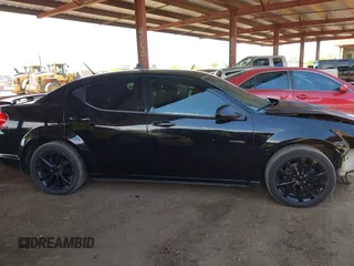 2014 Dodge Avenger SE z VIN 1C3CDZAG6EN138108, wystawiony jako IAAI lot #42068904 z przebiegiem 136 618 mil mil oraz . Historia ofert i sprzedaży dostępna na DreamBid. Obrazek 14.