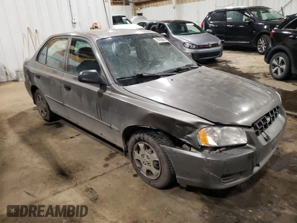 2000 Hyundai Accent z VIN KMHCG45G4YU090520, wystawiony jako Copart lot #79705864 z przebiegiem 145 490 mil mil oraz Szkoda całkowita • Salvage title. Historia ofert i sprzedaży dostępna na DreamBid. Obrazek 4.