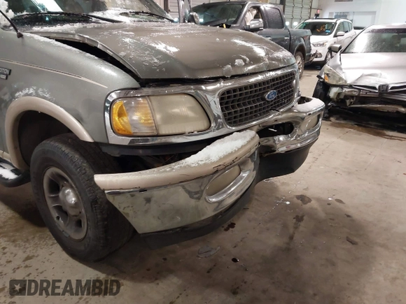 1999 Ford Expedition XLT z VIN 1FMPU18LXXLB47700, wystawiony jako IAAI lot #41592004 z przebiegiem Nie podano mil oraz . Historia ofert i sprzedaży dostępna na DreamBid. Obrazek 12.
