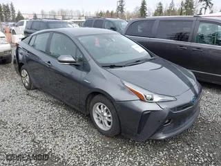 2021 Toyota Prius L Eco with VIN JTDKAMFU2M3143138, listed as a IAAI auction lot 41658263 with 102,718 mi miles. Bid and sale history available at carsss.com. Image 1.
