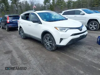 2018 Toyota RAV4 LE with VIN JTMBFREV5JJ738405, listed as a IAAI auction lot 41956145 with 100,593 mi miles and . Bid and sale history available at DreamBid. Image 1.