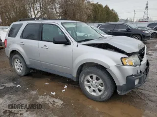 2011 Mazda Tribute Sport with VIN 4F2CY9C70BKM03826, listed as a Copart auction lot 45222665 with 171,082 mi miles and Salvage Title. Bid and sale history available at DreamBid. Image 4.