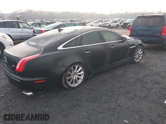2014 Jaguar XJ with VIN SAJWA1CZXE8V74400, listed as a IAAI auction lot 38250698 with 102,205 mi miles and . Bid and sale history available at DreamBid. Image 4.
