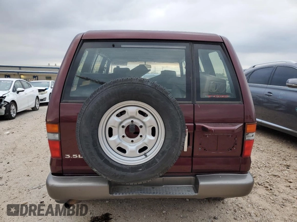 2000 Isuzu Trooper S with VIN JACDJ58X3Y7J09857, listed as a Copart auction lot 79924354 with Not provided miles and Clean title. Bid and sale history available at DreamBid. Image 6.