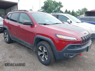2015 Jeep Cherokee Trailhawk with VIN 1C4PJMBS6FW575517, listed as a IAAI auction lot 42661199 with 299,166 mi miles and . Bid and sale history available at DreamBid. Image 1.