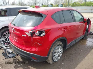 2014 Mazda CX-5 Touring with VIN JM3KE2CY4E0411780, listed as a IAAI auction lot 41903570 with 103,658 mi miles and . Bid and sale history available at DreamBid. Image 4.