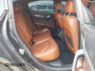 2014 Maserati Ghibli S Q4 with VIN ZAM57RTA0E1101059, listed as a IAAI auction lot 42121292 with 107,901 mi miles and . Bid and sale history available at DreamBid. Image 8.