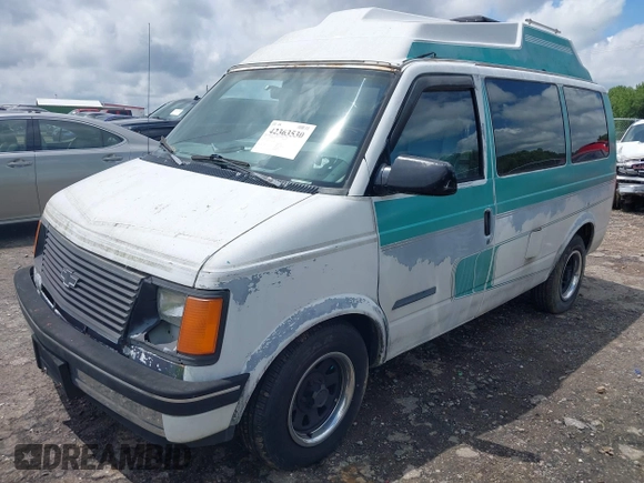 1991 Chevrolet Astro Cargo z VIN 1GBDM19Z7MB202913, wystawiony jako IAAI lot #42363530 z przebiegiem 191 695 mil mil oraz . Historia ofert i sprzedaży dostępna na DreamBid. Obrazek 2.