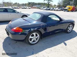 1999 Porsche Boxster with VIN WP0CA2983XU624800, listed as a IAAI auction lot 41897145 with 86,407 mi miles. Bid and sale history available at carsss.com. Image 4.