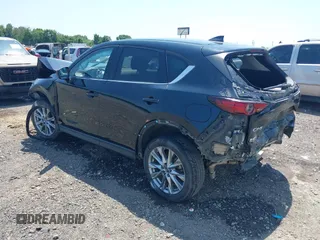 2020 Mazda CX-5 Grand Touring with VIN JM3KFADM9L1837183, listed as a IAAI auction lot 42340628 with 81,975 mi miles and . Bid and sale history available at DreamBid. Image 3.