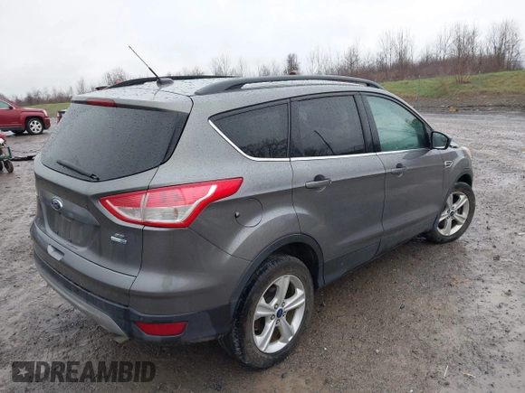 2014 Ford Escape SE with VIN 1FMCU9GX3EUB91417, listed as a IAAI auction lot 42009257 with 87,164 mi miles and . Bid and sale history available at DreamBid. Image 4.