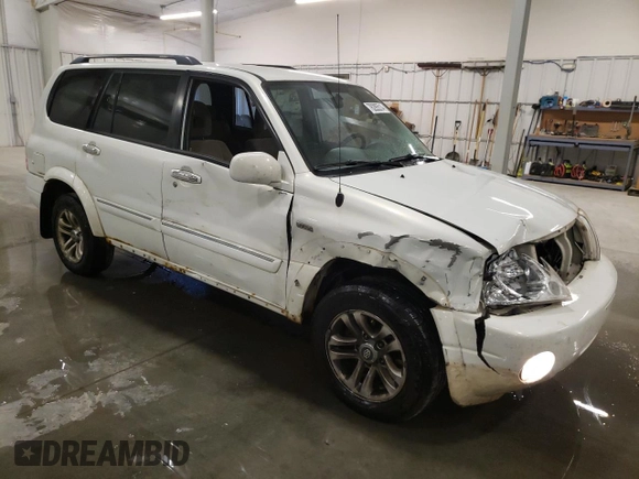 2004 Suzuki XL7 LX with VIN JS3TX92V044106650, listed as a Copart auction lot 76285514 with 185,356 mi miles and Salvage title. Bid and sale history available at DreamBid. Image 4.
