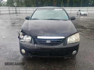 2005 Kia Spectra LX with VIN KNAFE121055134568, listed as a Copart auction lot 71541244 with 146,751 mi miles and Salvage Title. Bid and sale history available at carsss.com. Image 5.