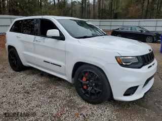 2021 Jeep Grand Cherokee SRT with VIN 1C4RJFDJ1MC561144, listed as a Copart auction lot 83961214 with 49,989 mi miles and Salvage Title. Bid and sale history available at carsss.com. Image 4.