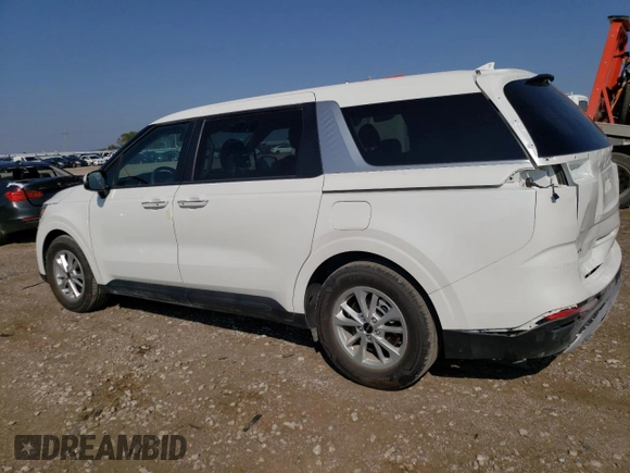 2023 Kia Carnival LX with VIN KNDNB4H35P6260181, listed as a Copart auction lot 74240714 with 6,879 mi miles and Salvage Title. Bid and sale history available at carsss.com. Image 2.