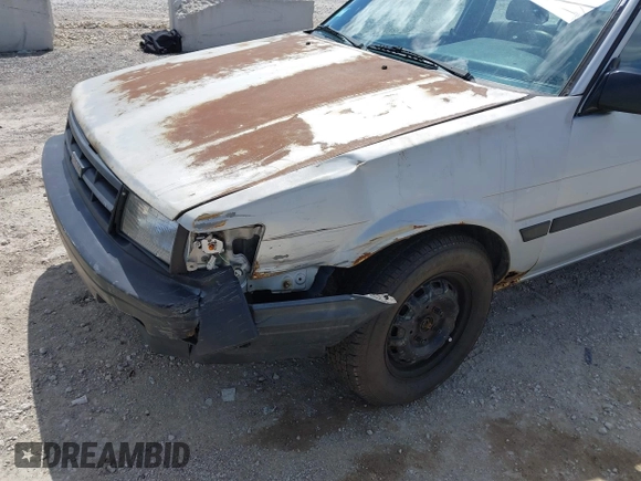 1986 Toyota Corolla with VIN JT2AE82E7G3318230, listed as a IAAI auction lot 42042219 with 74,689 mi miles and . Bid and sale history available at DreamBid. Image 6.