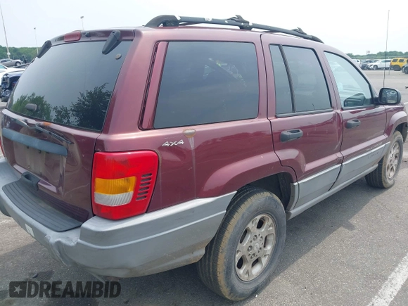 2000 Jeep Grand Cherokee Laredo z VIN 1J4GW48S2YC288439, wystawiony jako IAAI lot #42492798 z przebiegiem 272 527 mil mil oraz . Historia ofert i sprzedaży dostępna na DreamBid. Obrazek 4.