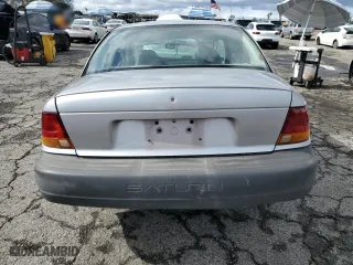 1996 Saturn SL with VIN 1G8ZH5288TZ156412, listed as a Copart auction lot 44429465 with 141,560 mi miles and Salvage Title. Bid and sale history available at carsss.com. Image 6.