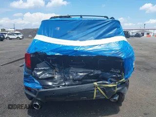 2023 Honda Passport Elite with VIN 5FNYF8H01PB030270, listed as a IAAI auction lot 42667744 with 7,931 mi miles and . Bid and sale history available at DreamBid. Image 16.