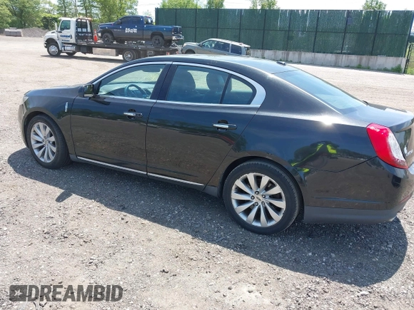 2013 Lincoln MKS with VIN 1LNHL9DKXDG601595, listed as a IAAI auction lot 42239041 with 224,537 mi miles and . Bid and sale history available at DreamBid. Image 3.