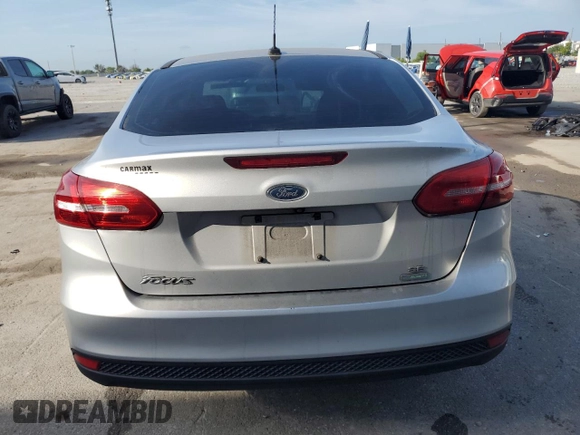 2017 Ford Focus SE with VIN 1FADP3FE9HL273889, listed as a Copart auction lot 53737055 with 114,700 mi miles and Salvage Title. Bid and sale history available at DreamBid. Image 6.