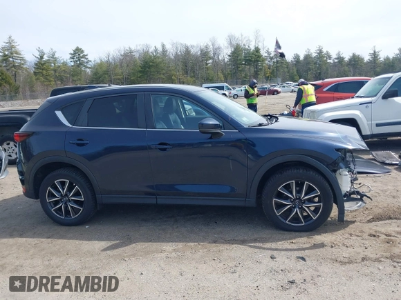 2018 Mazda CX-5 Touring z VIN JM3KFBCM4J0379871, wystawiony jako IAAI lot #41865130 z przebiegiem 48 674 mil mil oraz . Historia ofert i sprzedaży dostępna na DreamBid. Obrazek 14.