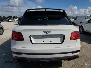 2019 Bentley Bentayga V8 z VIN SJAAM2ZV7KC025449, wystawiony jako Copart lot #62903583 z przebiegiem 12 615 mil mil oraz . Historia ofert i sprzedaży dostępna na DreamBid. Obrazek 6.