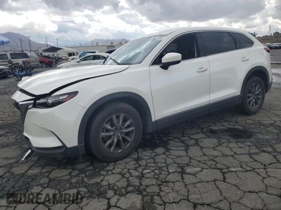 2021 Mazda CX-9 Touring with VIN JM3TCACY5M0527069, listed as a Copart auction lot 43014655 with 66,989 mi miles and Salvage title. Bid and sale history available at DreamBid. Image 1.