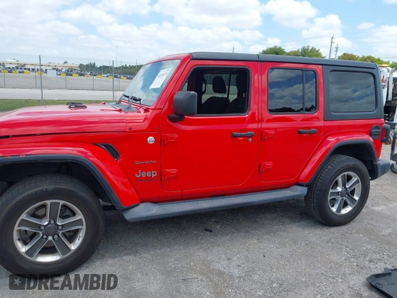 2019 Jeep Wrangler Unlimited Sahara with VIN 1C4HJXEG4KW573157, listed as a IAAI auction lot 42118373 with 105,890 mi miles and . Bid and sale history available at DreamBid. Image 14.