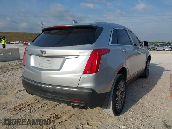 2017 Cadillac XT5 Luxury FWD with VIN 1GYKNBRS8HZ205769, listed as a IAAI auction lot 41865624 with 112,767 mi miles. Bid and sale history available at carsss.com. Image 4.