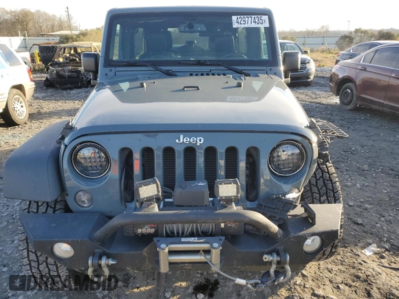 2015 Jeep Wrangler Unlimited Rubicon with VIN 1C4BJWFG7FL732694, listed as a Copart auction lot 42977435 with 128,759 mi miles and Salvage Title. Bid and sale history available at carsss.com. Image 5.