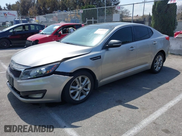 2013 Kia Optima EX z VIN 5XXGN4A70DG148060, wystawiony jako IAAI lot #41900134 z przebiegiem 149 214 mil mil oraz . Historia ofert i sprzedaży dostępna na DreamBid. Obrazek 2.