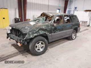 1997 Jeep Grand Cherokee Laredo z VIN 1J4GZ58YXVC729117, wystawiony jako IAAI lot #42244799 z przebiegiem Nie podano mil oraz . Historia ofert i sprzedaży dostępna na DreamBid. Obrazek 21.