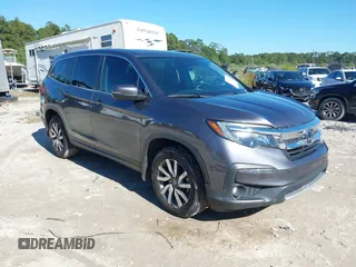 2021 Honda Pilot EX-L z VIN 5FNYF5H59MB013013, wystawiony jako IAAI lot #37801220 z przebiegiem 115 804 mil mil oraz . Historia ofert i sprzedaży dostępna na DreamBid. Obrazek 1.