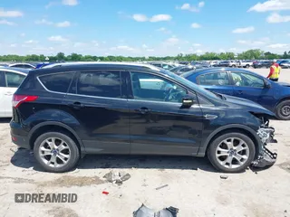 2015 Ford Escape Titanium with VIN 1FMCU0JX3FUB39808, listed as a IAAI auction lot 42212271 with 136,488 mi miles and . Bid and sale history available at DreamBid. Image 14.