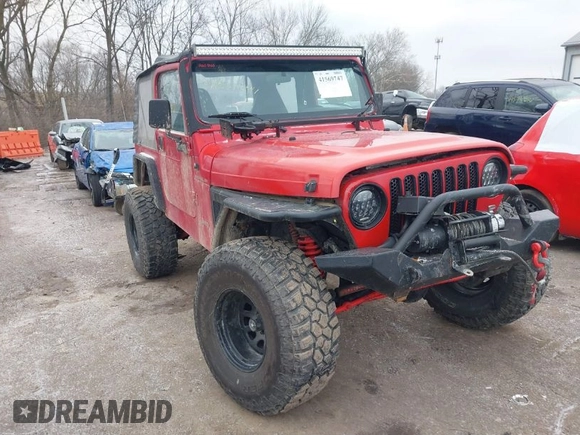 2002 Jeep Wrangler X z VIN 1J4FA39S52P708519, wystawiony jako IAAI lot #41569747 z przebiegiem 219 168 mil mil oraz . Historia ofert i sprzedaży dostępna na DreamBid. Obrazek 1.