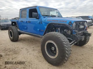 2021 Jeep Gladiator Rubicon with VIN 1C6JJTBM1ML611203, listed as a Copart auction lot 87203924 with 27,645 mi miles and Salvage title. Bid and sale history available at DreamBid. Image 4.