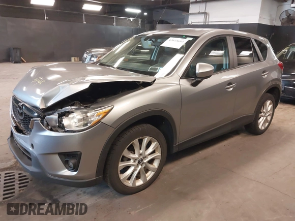 2014 Mazda CX-5 Grand Touring with VIN JM3KE4DY9E0373974, listed as a IAAI auction lot 42073693 with 86,755 mi miles. Bid and sale history available at carsss.com. Image 17.