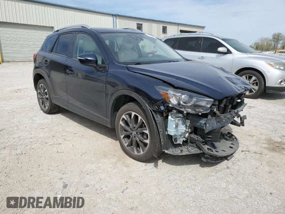2016 Mazda CX-5 Grand Touring with VIN JM3KE4DYXG0844002, listed as a Copart auction lot 52712035 with 81,042 mi miles and Salvage Title. Bid and sale history available at DreamBid. Image 4.