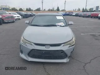 2014 Scion tC with VIN JTKJF5C71E3077886, listed as a IAAI auction lot 41939128 with 138,845 mi miles. Bid and sale history available at carsss.com. Image 12.