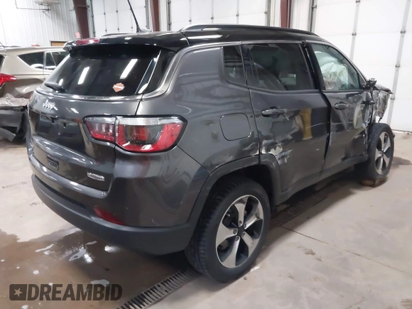 2019 Jeep Compass Latitude z VIN 3C4NJDBB3KT828901, wystawiony jako IAAI lot #41873087 z przebiegiem 49 107 mil mil oraz . Historia ofert i sprzedaży dostępna na DreamBid. Obrazek 4.