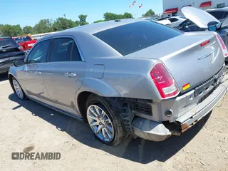 2014 Chrysler 300 with VIN 2C3CCAAG8EH264595, listed as a IAAI auction lot 42076996 with 101,659 mi miles and . Bid and sale history available at DreamBid. Image 3.