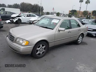 1995 Mercedes-Benz C with VIN WDBHA28E2SF191740, listed as a IAAI auction lot 41172625 with 331,540 mi miles. Bid and sale history available at carsss.com. Image 2.